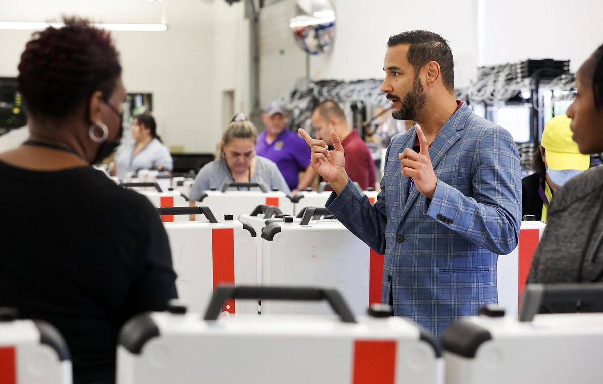 Tarrant Elections administrator Heider Garcia talks to Tarrant County employees testing voting machines on Friday, September 23, 2022, in Fort Worth.