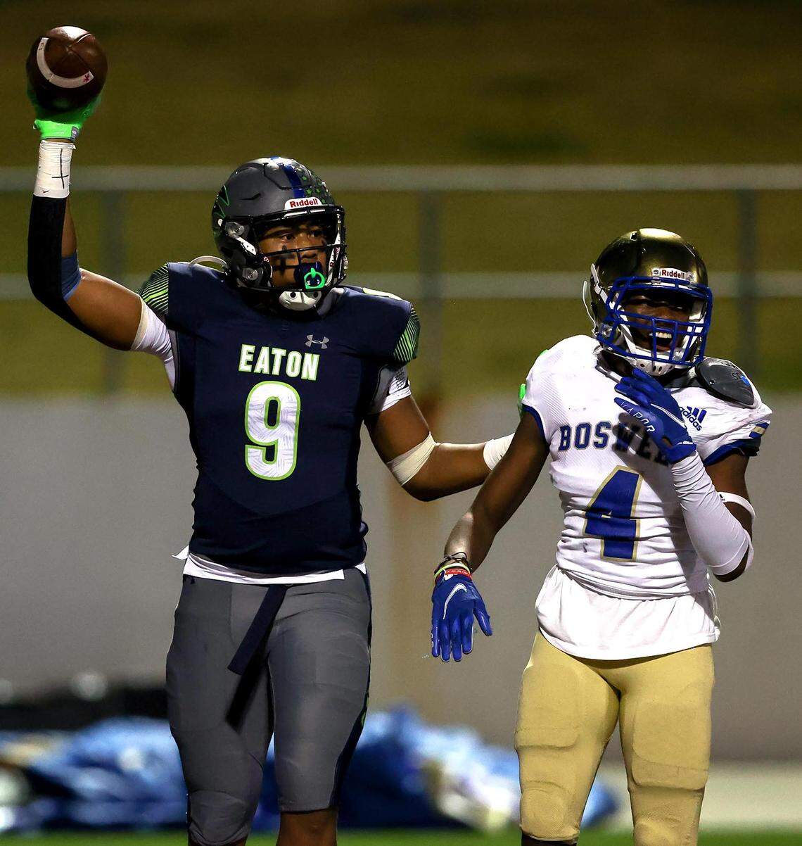 Eaton wide receiver Jaden Platt (9) celebrates a touchdown reception against Boswell defensive back Henry Marvie (4) during the first half of the 6A Bi-District Region I Division II High School Football playoff game played at Northwest ISD Stadium on Thursday, November 11, 2021, in Justin. (Steve Nurenberg/Special to the Star-Telegram)