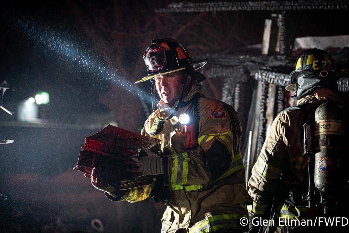 Firefighters salvaged photo albums and other keepsakes from a west Fort Worth outbuilding that was destroyed by flames early Friday, March 13.