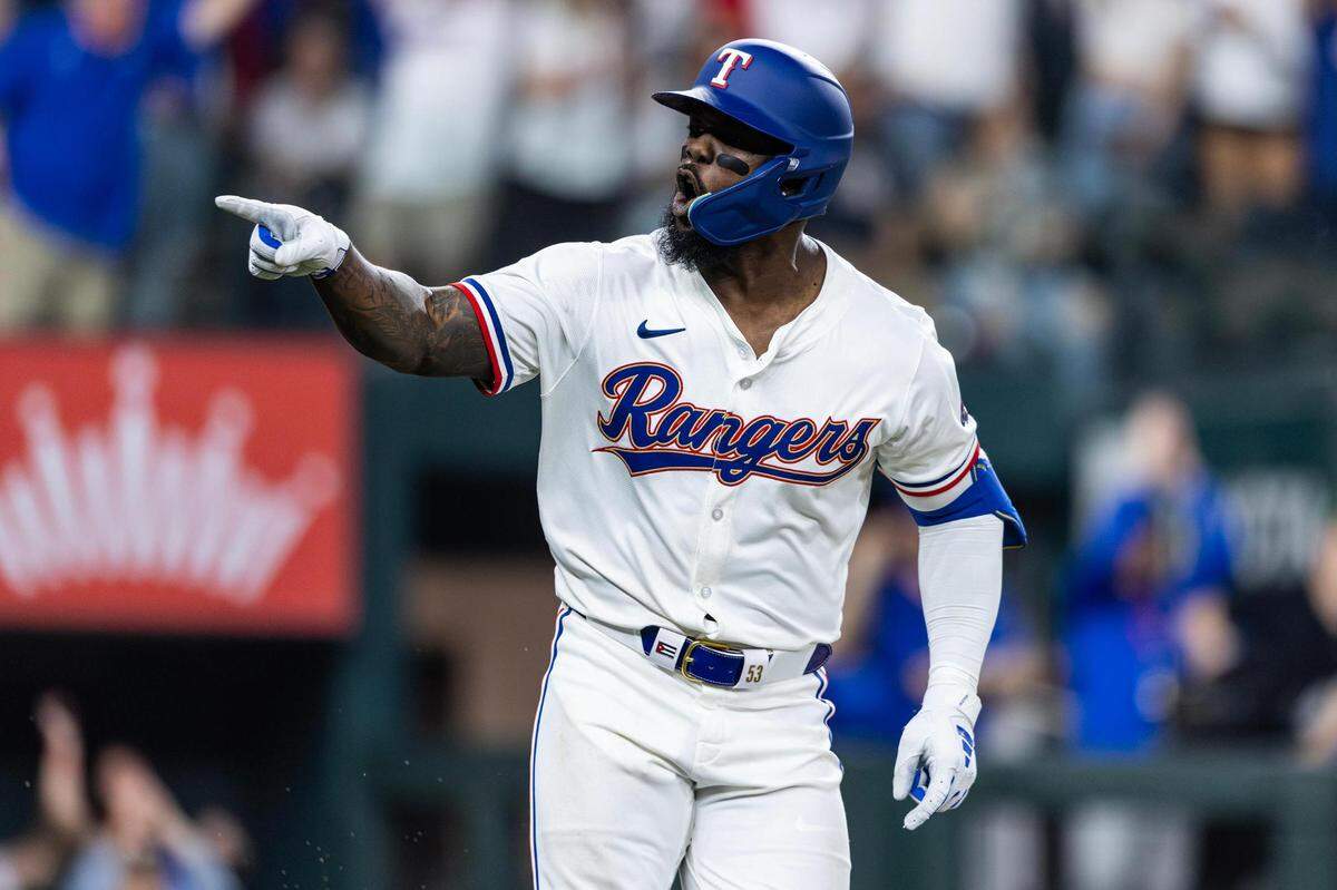 Texas Rangers outfielder Adolis Garcia (53) celebrates after hitting his first home run of the season in the sixth inning in their season opener against the Chicago Cubs at Globe Life Field in Arlington on Thursday, March 28, 2024.