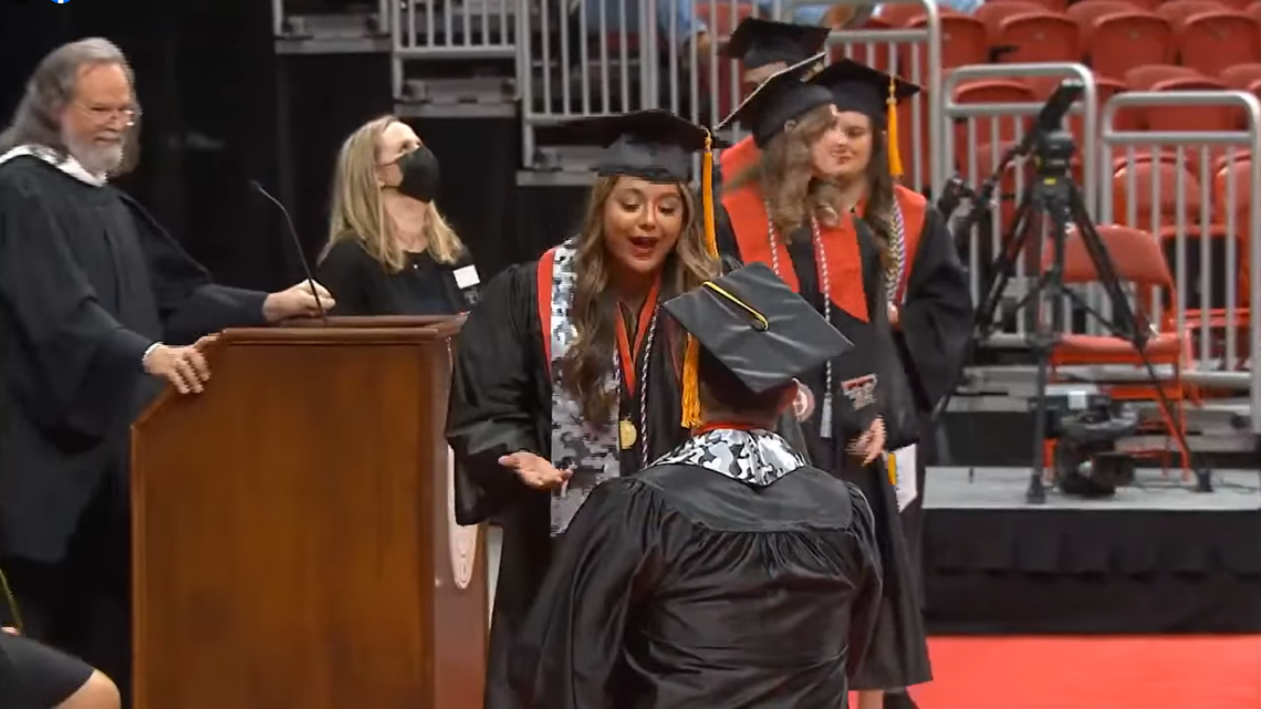 Devin Del Rio proposes to Leann Majory after their names were called at a Texas Tech University commencement ceremony on Saturday. Dec. 11.