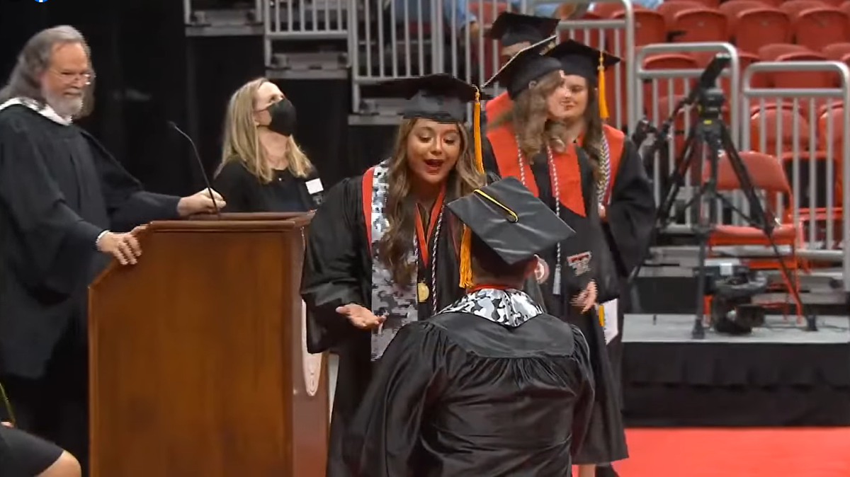 Devin Del Rio proposes to Leann Majory after their names were called at a Texas Tech University commencement ceremony on Saturday. Dec. 11.