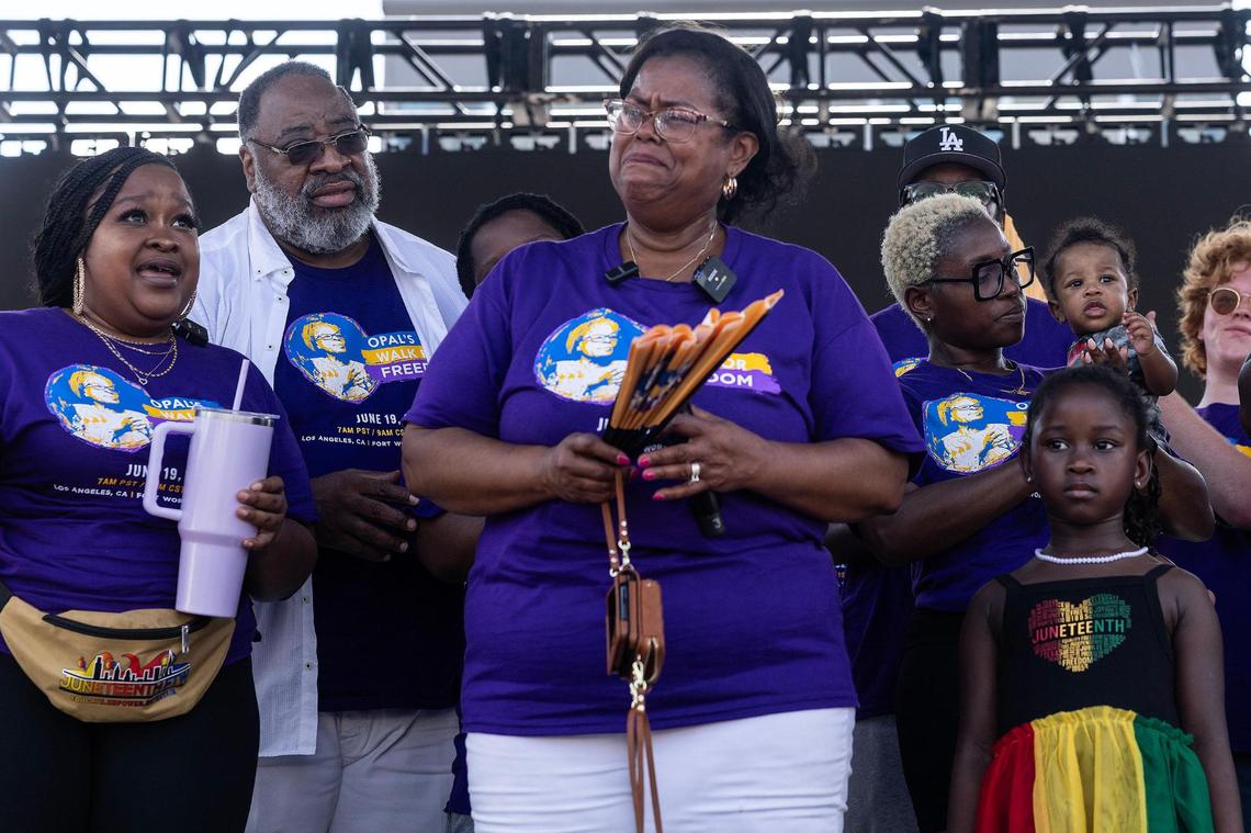 Dione Sims, the granddaughter of Opal Lee, becomes emotional talking about her grandmother on stage following the Opal Lee Walk for Freedom at Farrington Field in Fort Worth on Thursday, June 19, 2025. Lee was not able to participate in this years walk due to health concerns.