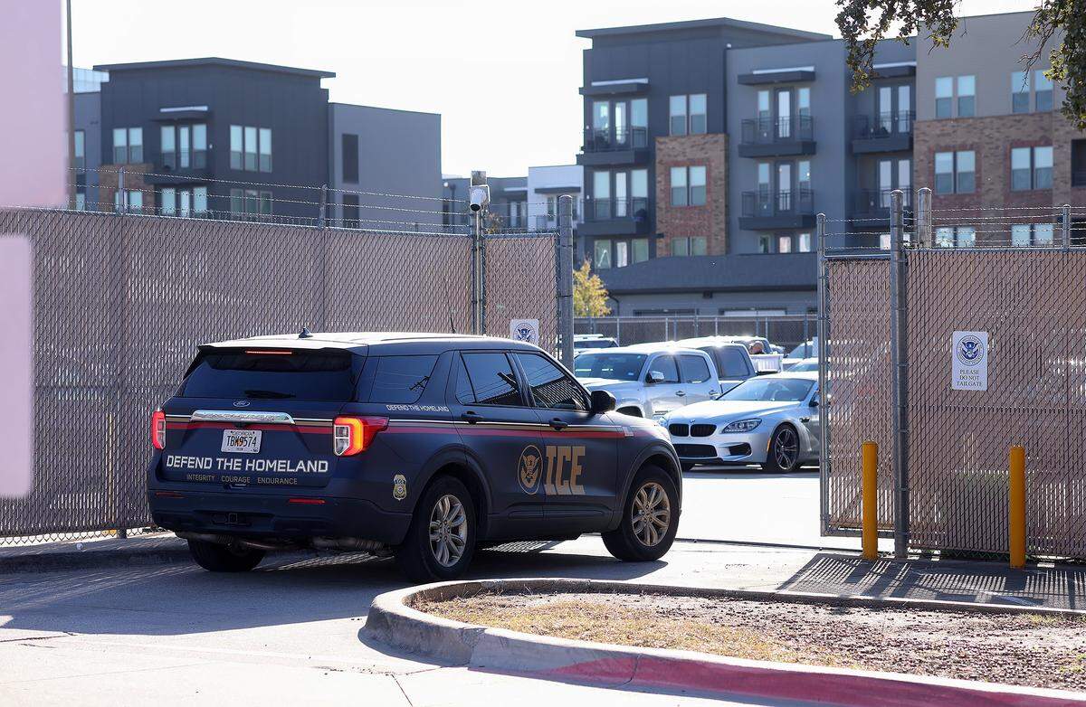 An U.S. Immigration and Customs Enforcement (ICE) vehicle enters the gated back lot of the ICE field office in Dallas on Friday, Jan. 16, 2026. 