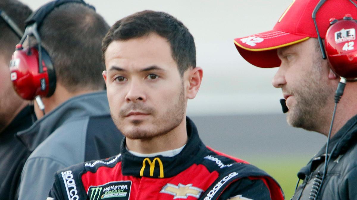 Driver Kyle Larson (42) stands on the grid during NASCAR Monster Energy Series Cup qualifying at Texas Motor Speedway in Fort Worth, Texas, Saturday, November 2, 2019.
