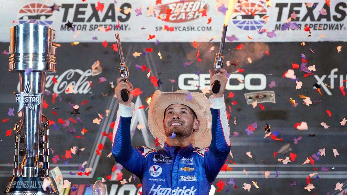 Kyle Larson shoots pistols as he celebrates in Victory Lane after winning the NASCAR Cup Series All-Star Race at Texas Motor Speedway last June.