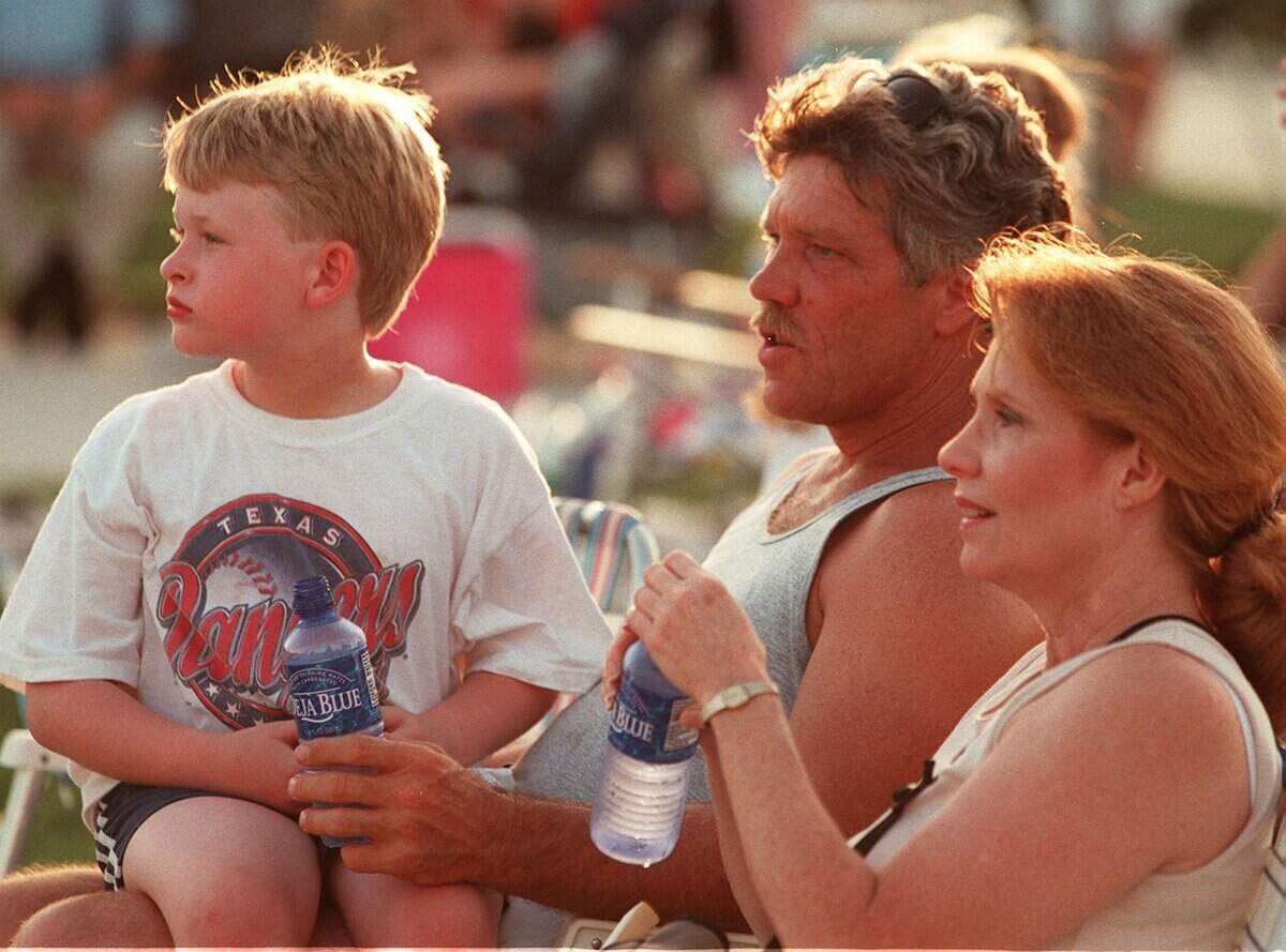 July 3, 1999: The city of Southlake held a celebration for Independence Day at Town Square. Matthew Pomroy, left, Stephen Pomroy and Carolyn DeVore of Arlington attended.