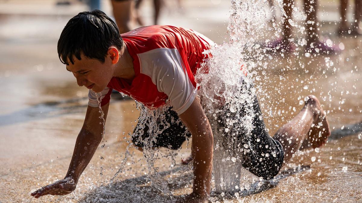 Marlon Lara, 9, plays on the splash pad at Sycamore Water Park in Fort Worth on Thursday, June 27, 2024. Temperatures rose to over 100 degrees as the summer heatwave begins to heat up.