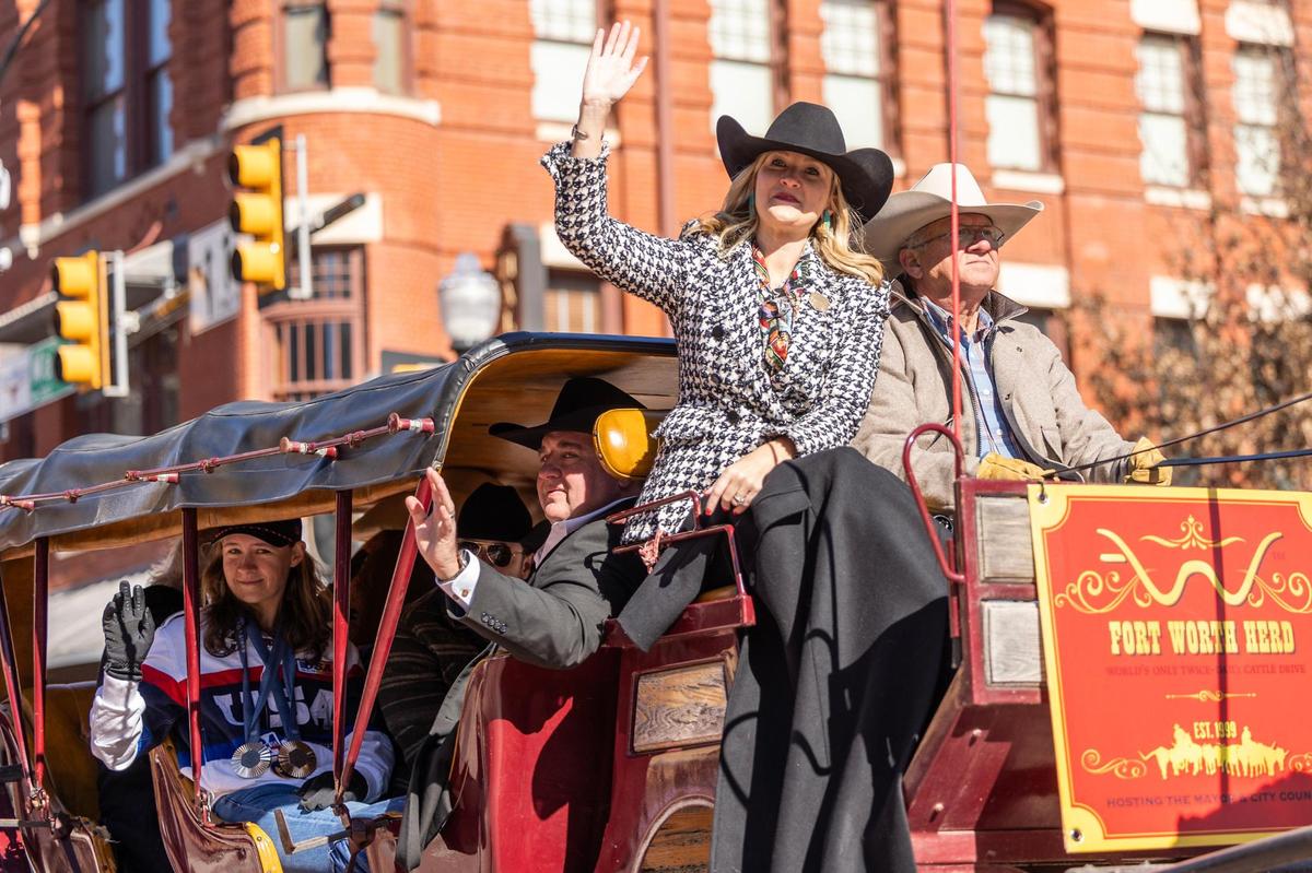 Fort Worth Mayor Mattie Parker rides in a carriage with Olympian and North Texas resident Austen Smith down Main Street for the Fort Worth Stock Show All Western Parade down Main Street in downtown Fort Worth on Saturday, Jan. 18, 2025.