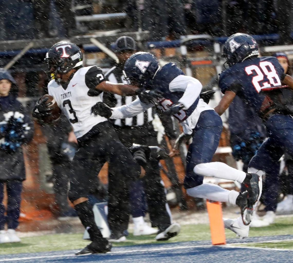Trinity running back Gary Maddox (3) is shoved out of the end zone by Allen defensive back Greg Hawkins (36) as Maddox scored Trinity’s final touchdown during a high school Class 6A Division 1 Regional playoff game at Eagle Stadium in Allen, Texas, Saturday, Nov. 27, 2021. Allen defeated Trinity 59-21 to move on to the quarterfinals. (Special to the Star-Telegram Bob Booth)