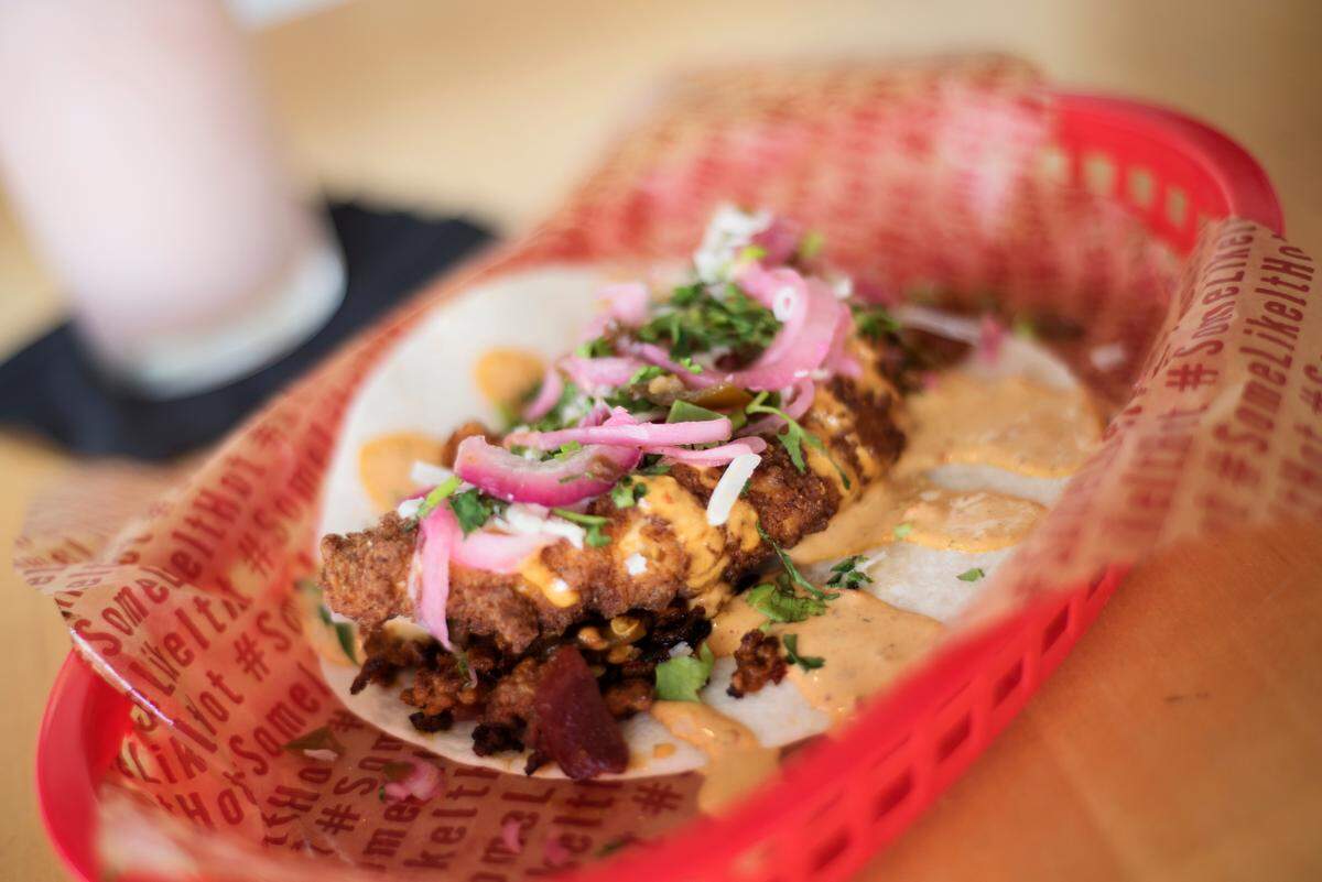 ‘The Creeper,’ featuring habanero-battered fried chicken, chorizo, ‘Brushfire’ jalapeños and more with a drizzle of creamy ghost-pepper sauce. Available Aug. 13-31 as part of the ‘Some Like it Hot’ promotion at Torchy’s Tacos.