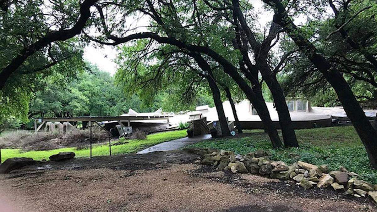 This “partially submerged earth-type concrete off-grid capable home” has a lot to offer a new owner.