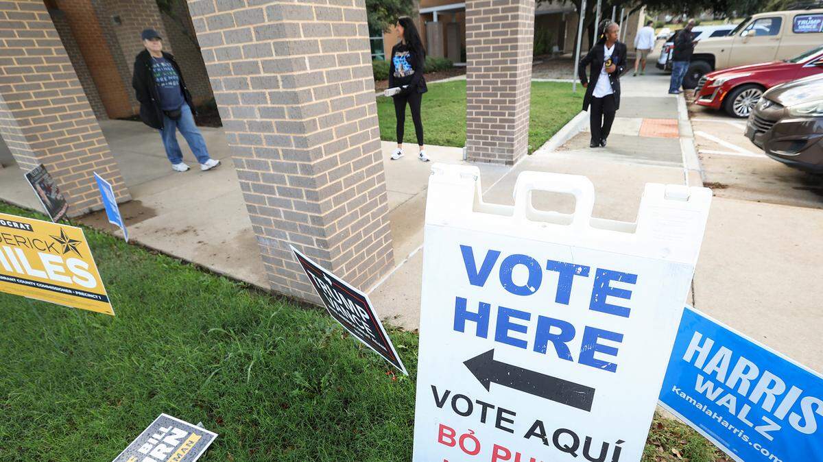 A "vote here" sign outside a polling place