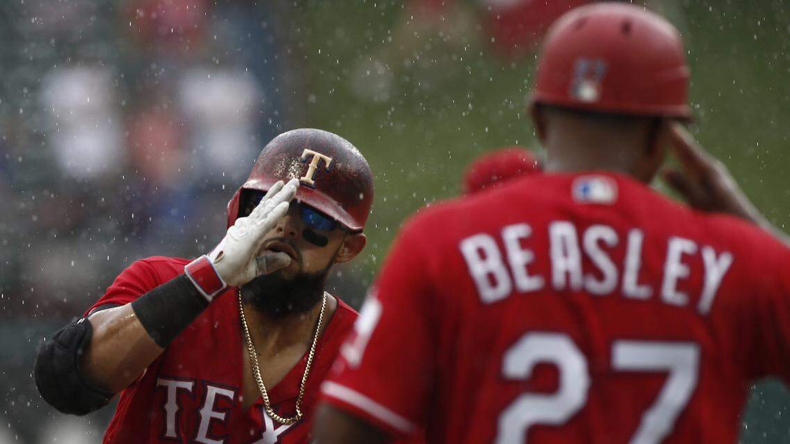 Rougned Odor circled the bases Sunday after a three-run homer as heavy rain fell at Globe Life Park. His homer gave the Rangers the lead just before a 56-minute rain delay.
