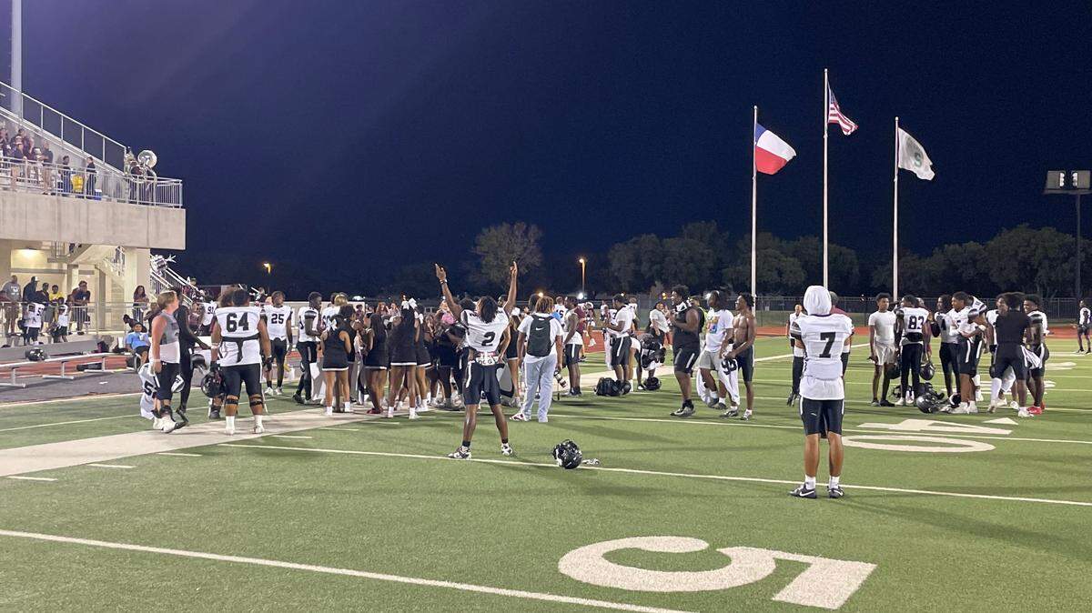 Mansfield Timberview football celebrates after staying undefeated.