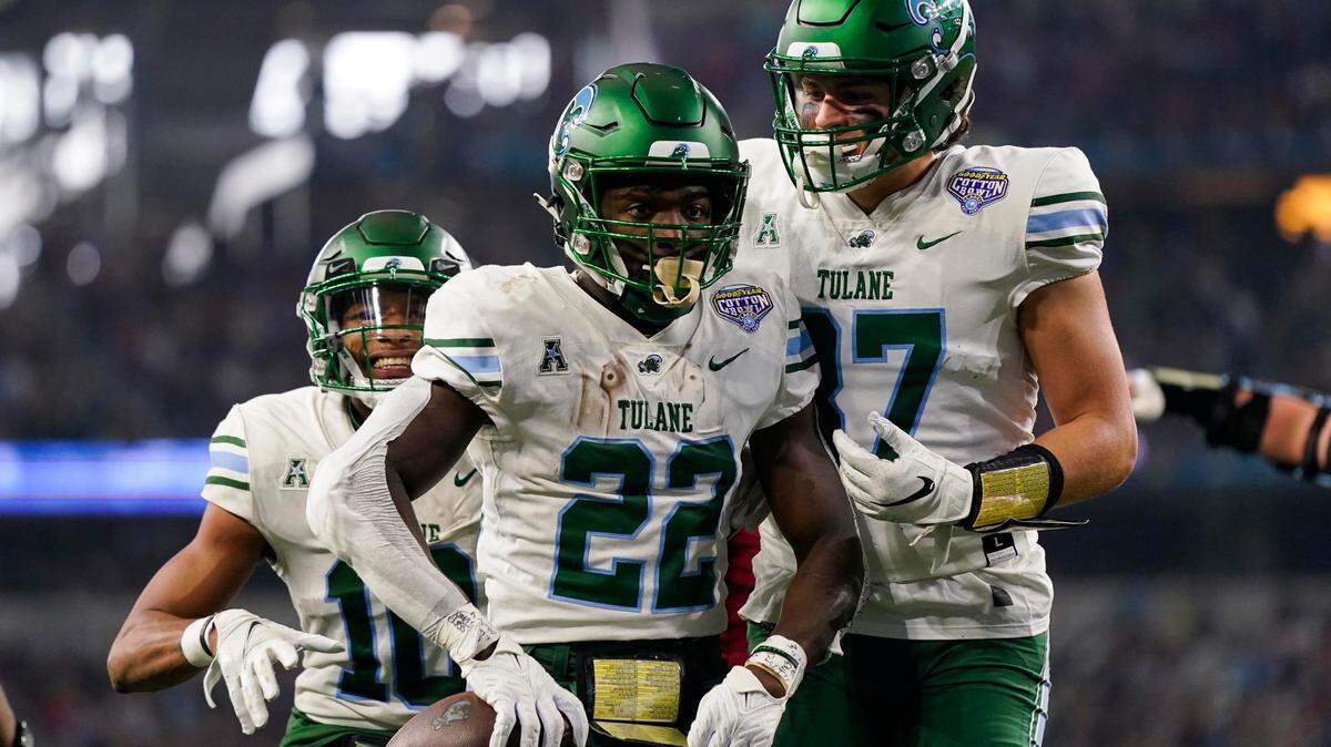 Tulane running back Tyjae Spears (22) celebrates after scoring a touchdown during the Cotton Bowl on Monday.