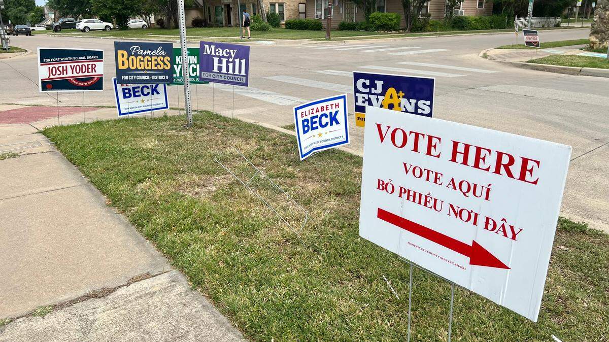Campaign signs line a curb at North Hi Mount Elementary School in Fort Worth for municipal and school elections May 6, 2023.