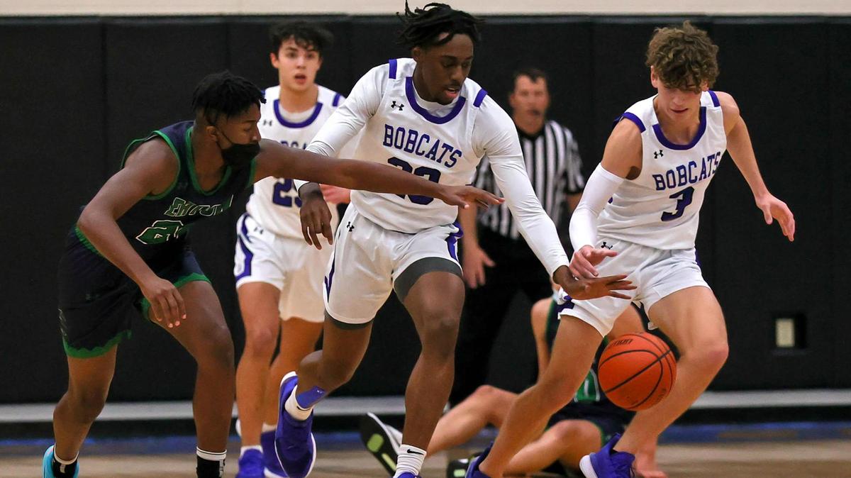 Byron Nelson guard Finley Bizjack (3), forward Jesse Iweze (C) and Eaton guard Charles Whitebear (L) go for a loose ball during the first half of a High School Basketball game played at Byron Nelson High School on January 19, 2021. (Steve Nurenberg Special to the Star-Telegram)