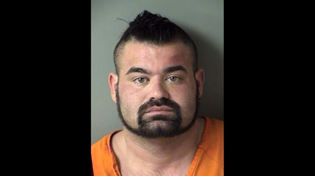 Dallas police officer Christopher Hankins, 30, is accused of shoplifting from a Denton County Wal-Mart.