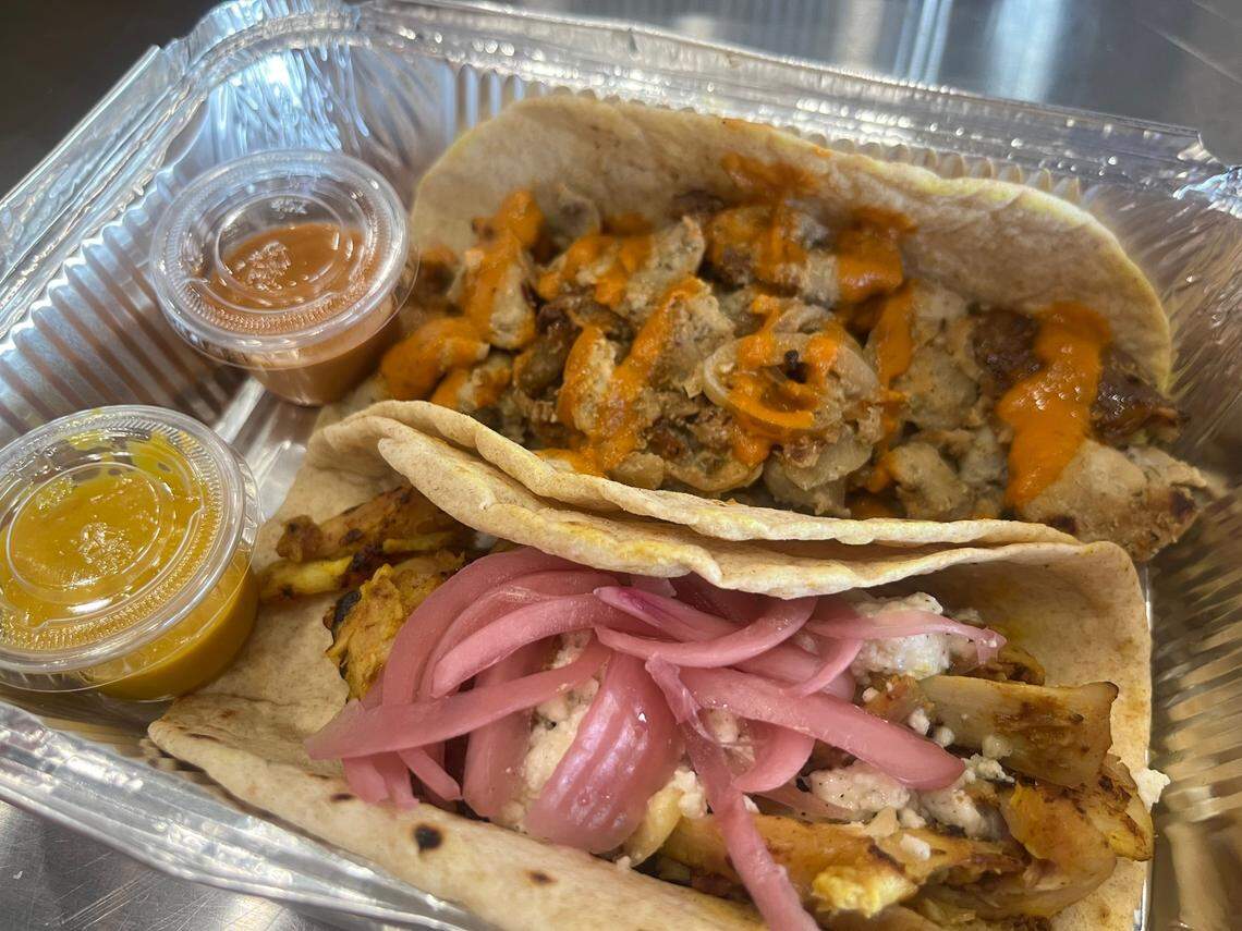 The pork and chicken tacos from Tacos Y Rocky with salsa amba and salsa arabe.