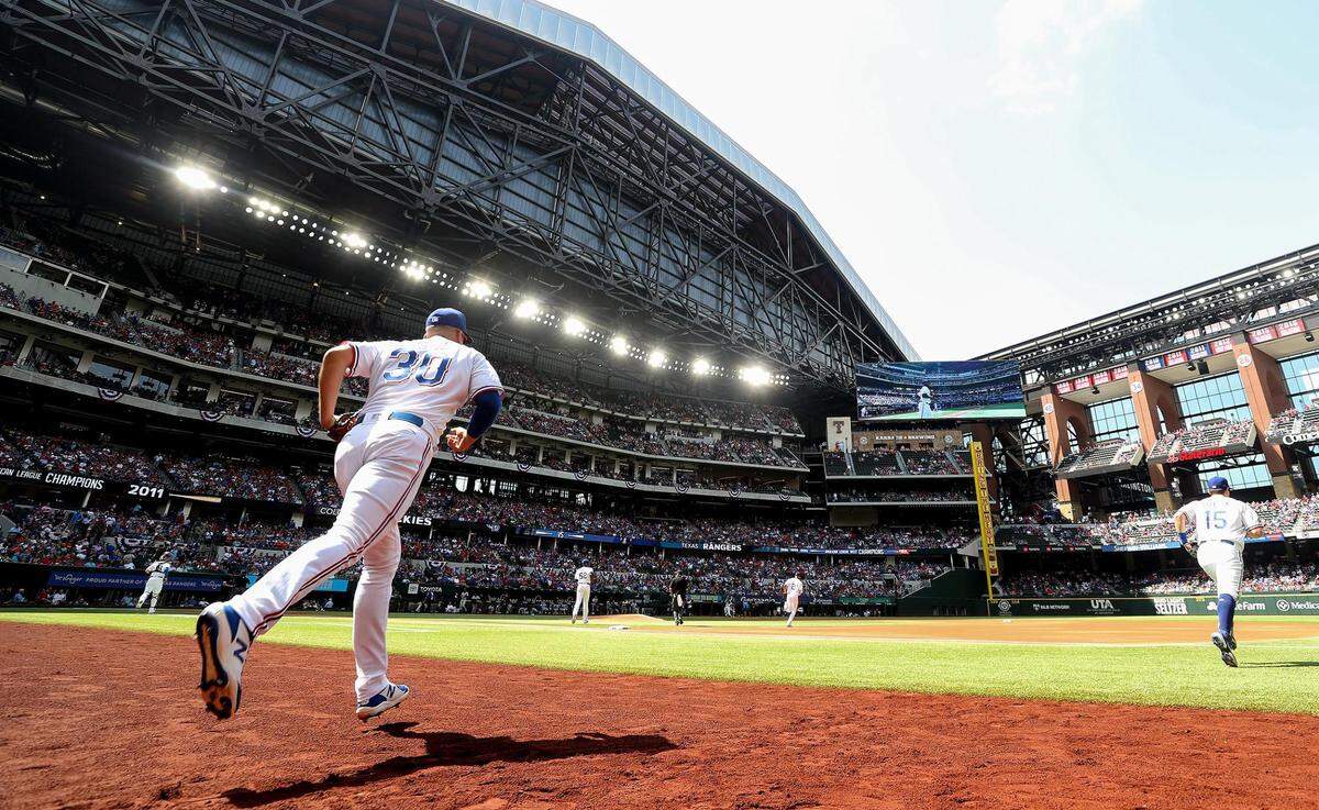 The Texas Rangers take the field at the start of the home opener against the Colorado Rockies on Monday, April 11, 2022, at Globe Life Field.