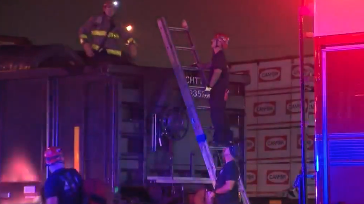A man who was pinned inside a freight car of a train was rescued by San Antonio firefighters.