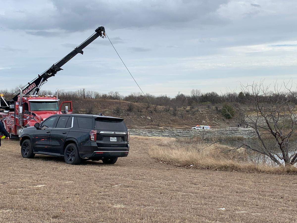 Firefighters were working Thursday afternoon to recover the body of a woman who was believed to have drowned after she intentionally drove into the water at a rock quarry near the Trailwood neighborhood in north Fort Worth, authorities said.