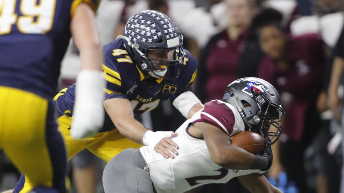 Timberview running back Duece Jones (2) is brought down by Highland Park’s Colby Hopkins (47) in the first half of a high school 5A Division I Regional Round football playoff game at Ford Center in Frisco, Texas, Saturday, Dec. 01, 2018. Highland Park led by 38 at the half. (Star-Telegram Bob Booth)