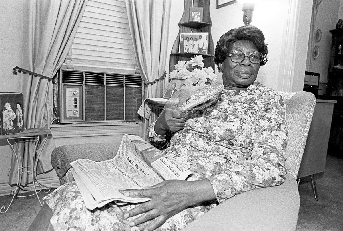 July 29, 1980: Bessie Woolen sits in her Colvin Street home in Fort Worth, fanning herself to get relief from the heat. Woolen was one of over 150 Tarrant County residents who applied for heat relief aid.