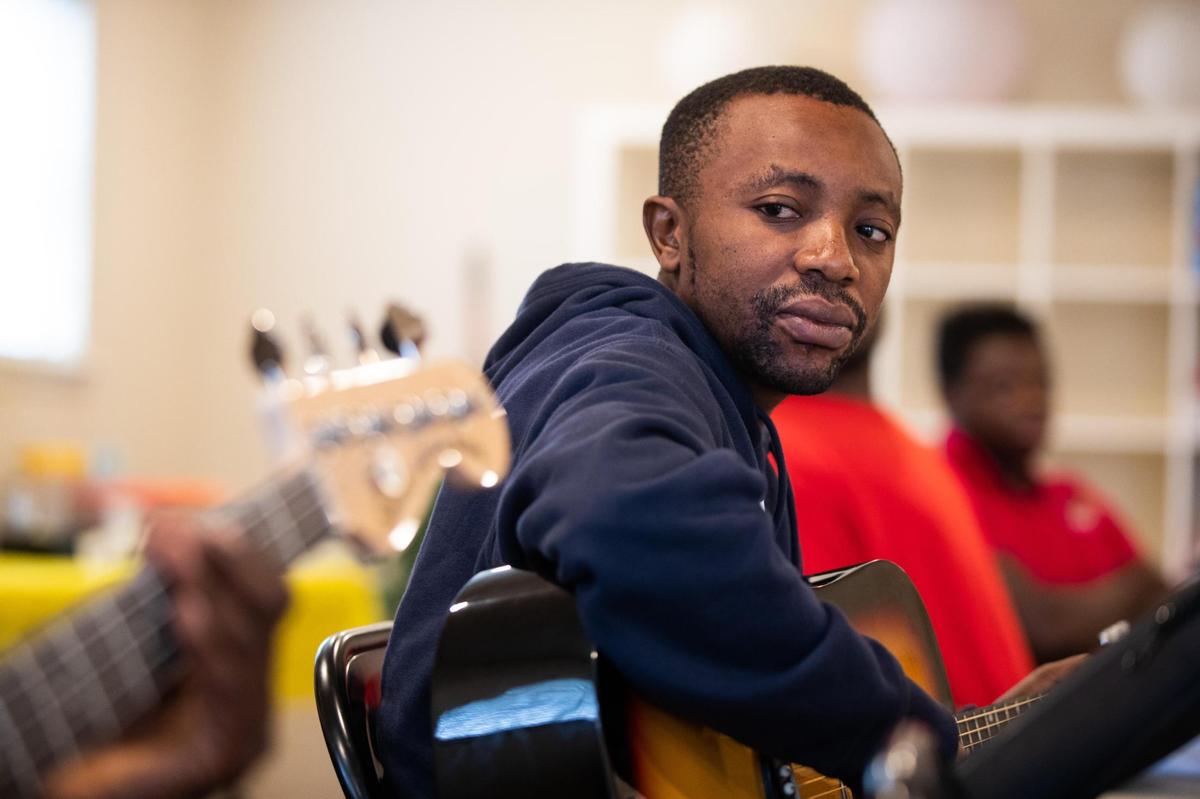 Eca Kimba watches Abale Kalonga for pacing as they practice instruments during Refugee Music Collaborative Saturday, Dec. 4, 2021, in Fort Worth.