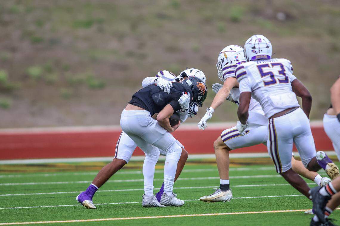 Springtown quarterback Kaine Hill (7) gets sacked by Alvarado’s Anthony Frias (58) during a Class 4A Division I regional semifinal Friday, Nov. 28, 2025, at Knight Stadium at Eagle Mountain High School in Fort Worth.
