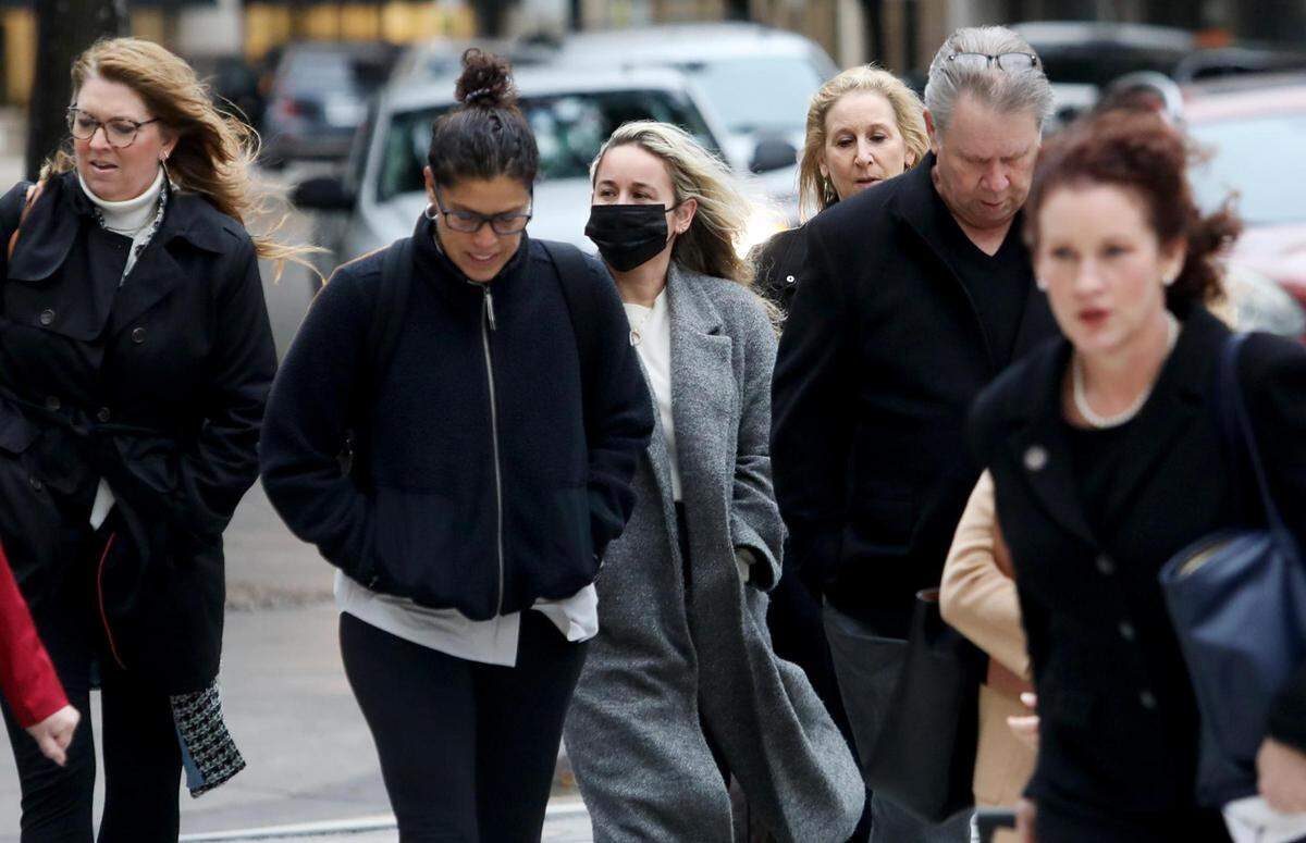 Carli Skaggs, widow of Angels pitcher Tyler Skaggs, center, walks into the federal courthouse in Fort Worth on Thursday, February 17, 2022.