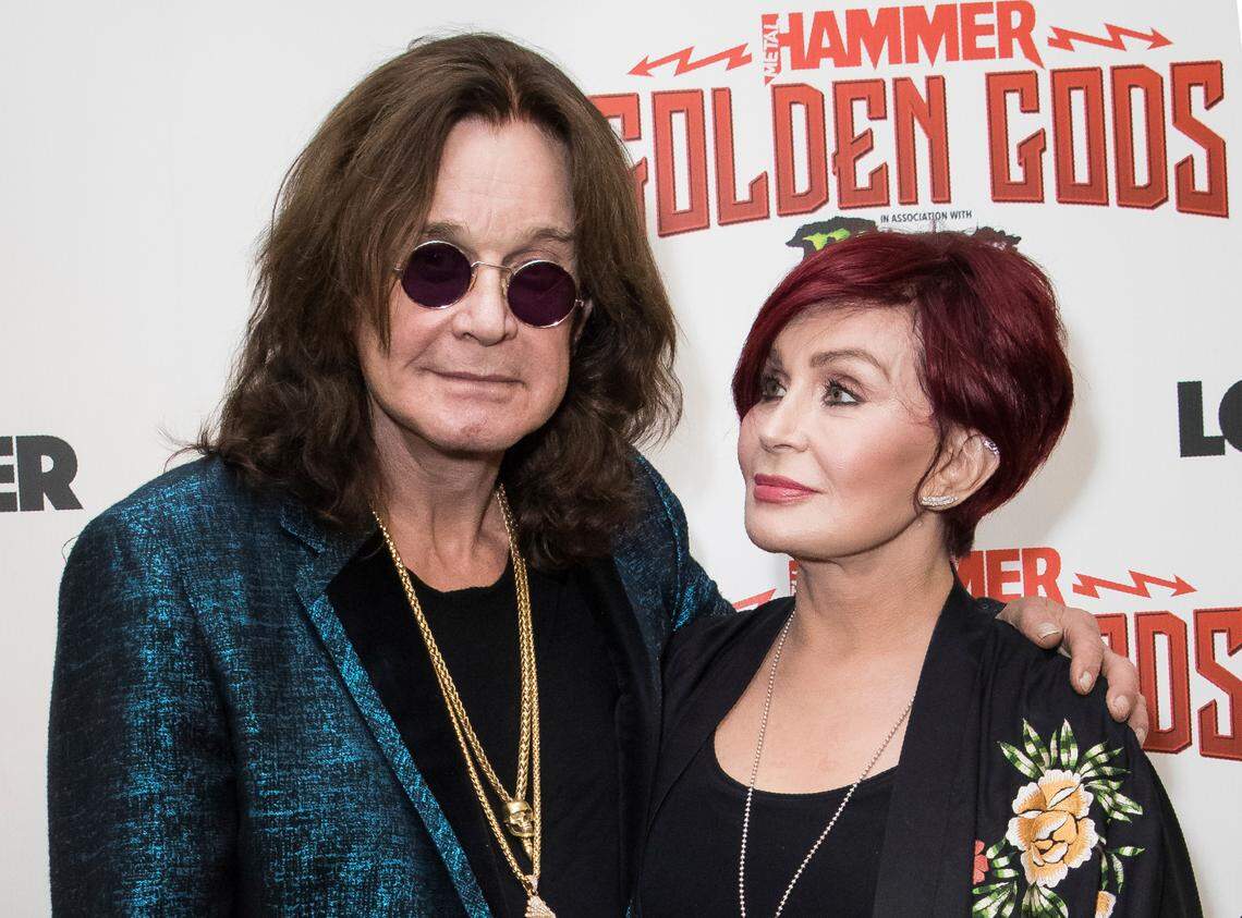FILE - This June 11, 2018 file photo shows musician Ozzy Osbourne, left, and his wife Sharon Osbourne at the Metal Hammer Golden God awards in London. The 71-year-old Grammy winner and former vocalist for the metal band Black Sabbath said during an interview on “Good Morning America” that aired Tuesday, Jan. 21, 2020, that he’s been diagnosed with Parkinson’s disease, a nervous system disorder that affects movement. The diagnosis came after a fall last year. (Photo by Vianney Le Caer/Invision/AP, File)