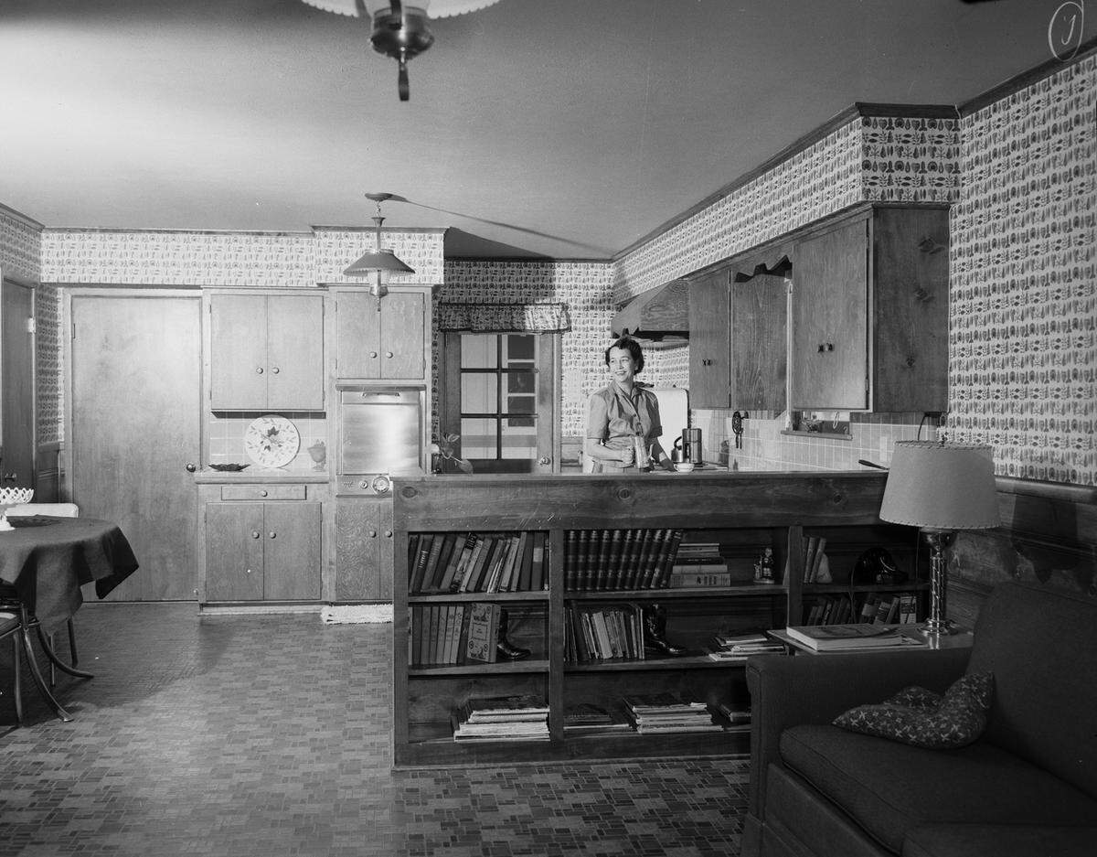 April 5, 1955: Mrs. Philip M. James in kitchen of the family residence, 5601 Blueridge Drive, Fort Worth