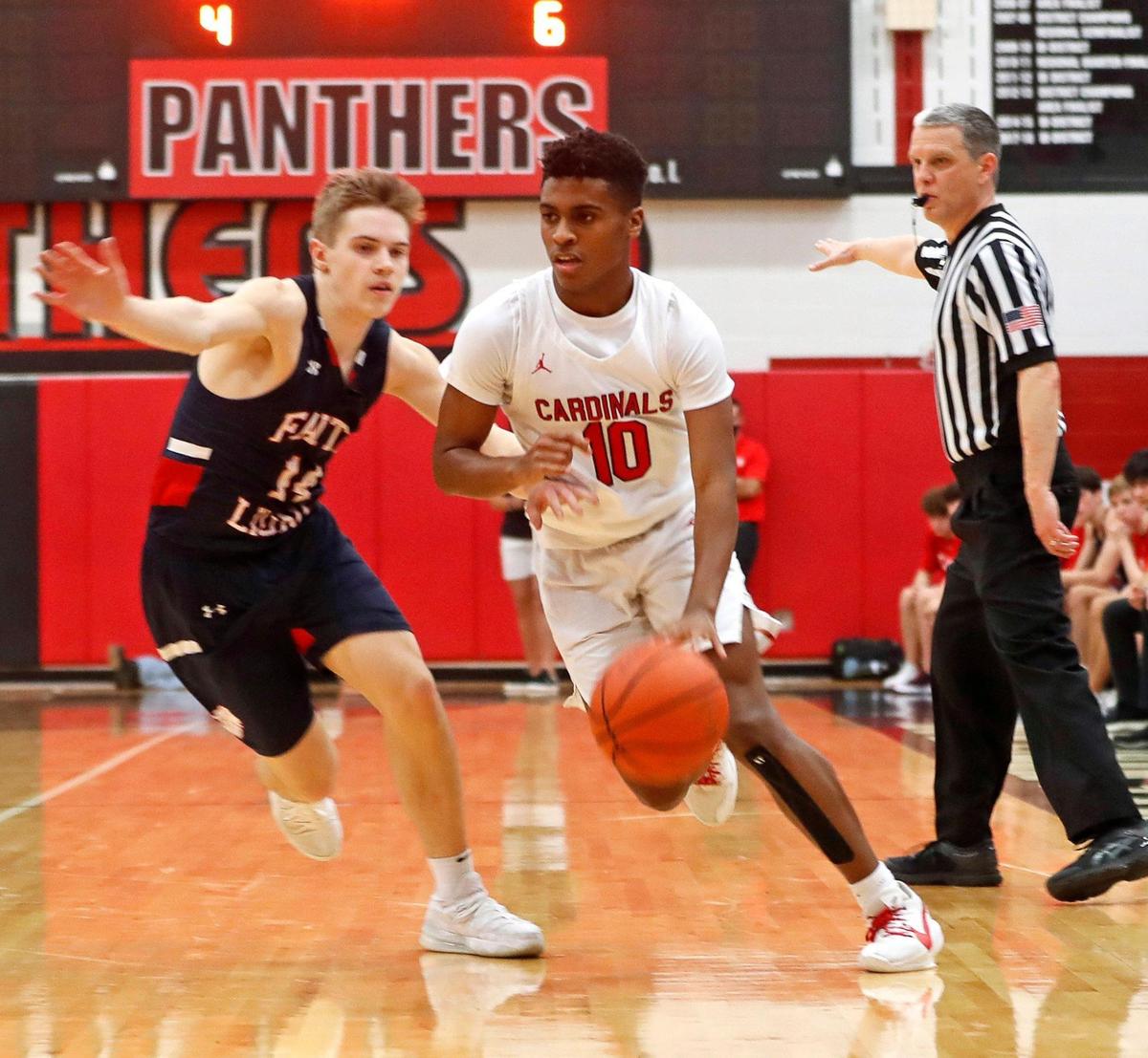 Fort Worth Christian’s Courtland Barbarin (10) drives to the key defended by Grapevine Faith’s Grant Rein (14) during the TAPPS 5A State Semifinal basketball game at Colleyville Heritage High School in Colleyville, Texas, Tuesday, March 09, 2021. Fort Worth Christian defeated Grapevine Faith 72-65. (Special to the Star-Telegram Bob Booth)