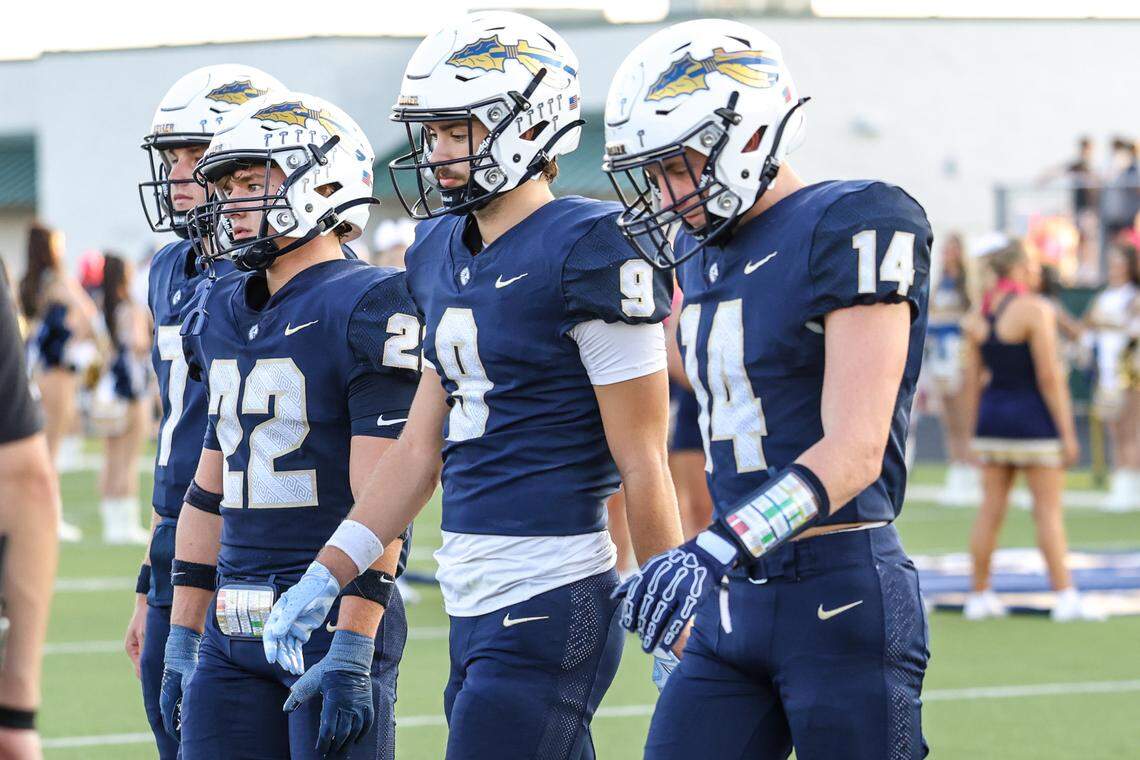 The Keller High School captains take the field before  Friday’s District 4-6A game against Northwest High at Keller ISD Stadium. Tom Marvin / Special to the Star-Telegram