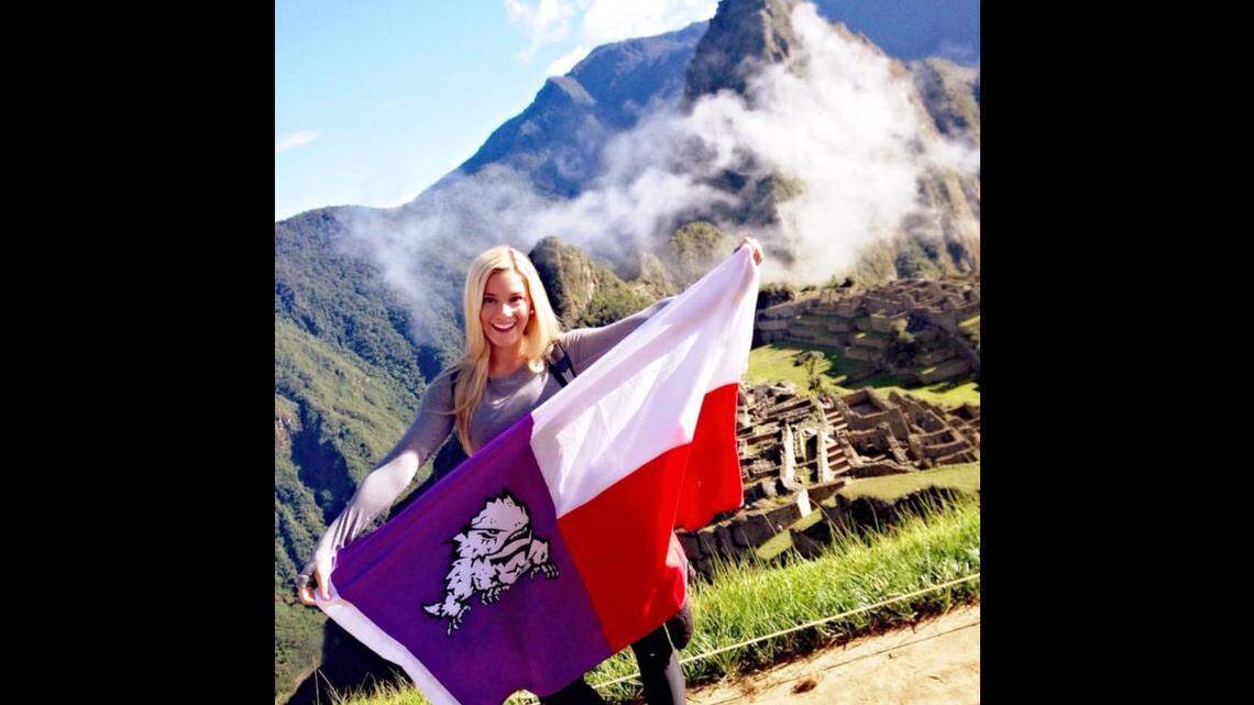 Sarah Summers, who was crowned Miss USA last week, waves her Horned Frog flag during a "May-mester" in Peru.