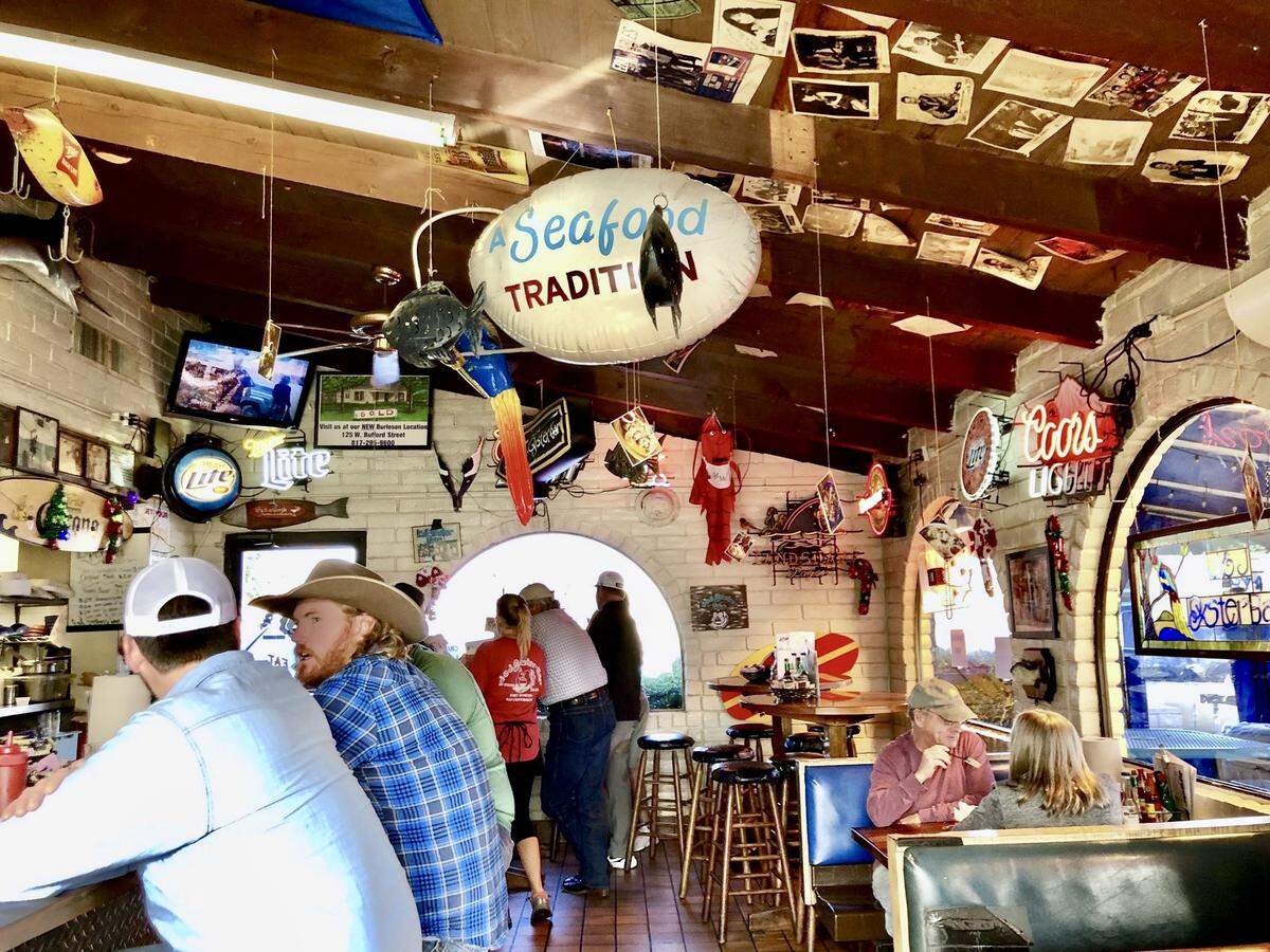 &J Oyster Bar has a cozy dining room and a patio lined with palm trees, as seen Jan. 15, 2023.