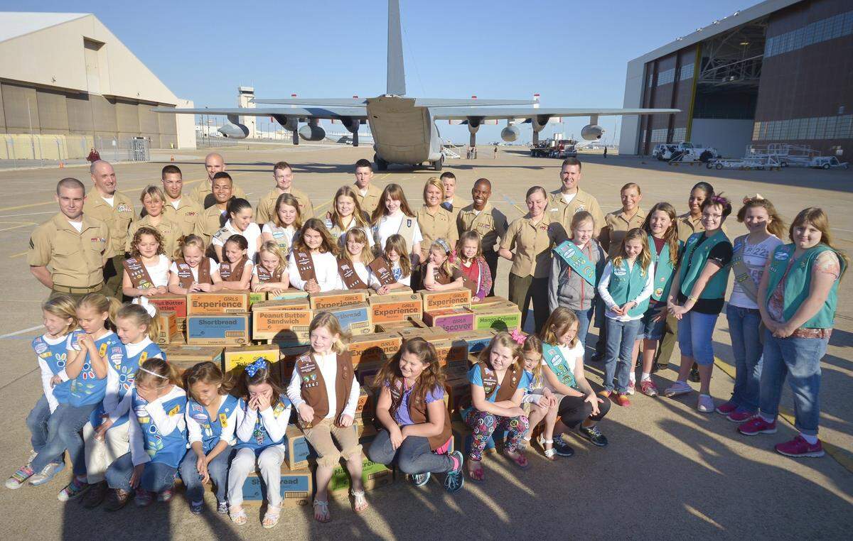 March 15, 2013: Parker County Girl Scouts delivered more than 1,000 boxes of Girl Scout cookies to military officials at the Fort Worth NAS in Fort Worth.