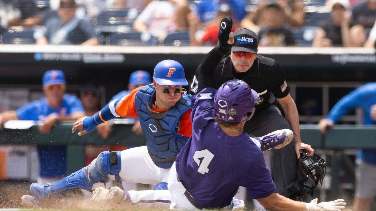 Florida’s BT Riopelle, left, tags out TCU’s Kurtis Byrne at home plate off a double by Logan Maxwell during the fourth inning of Wednesday's World Series game. 
