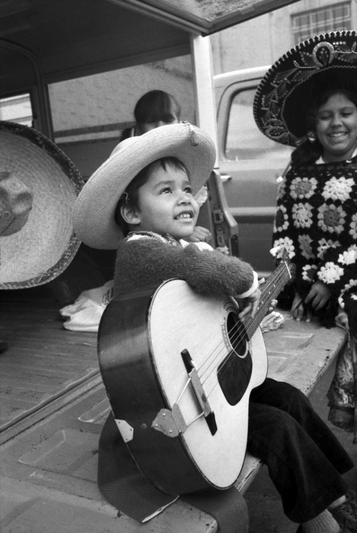 Sept. 14, 1974: Michael Cerda, 4, son of Mr. and Mrs. Marino Cerda of 2302 Jennings, is seen holding a guitar and looking up towards the sky as the threat of rain loomed over the Mexican Independence Day parade in Fort Worth.