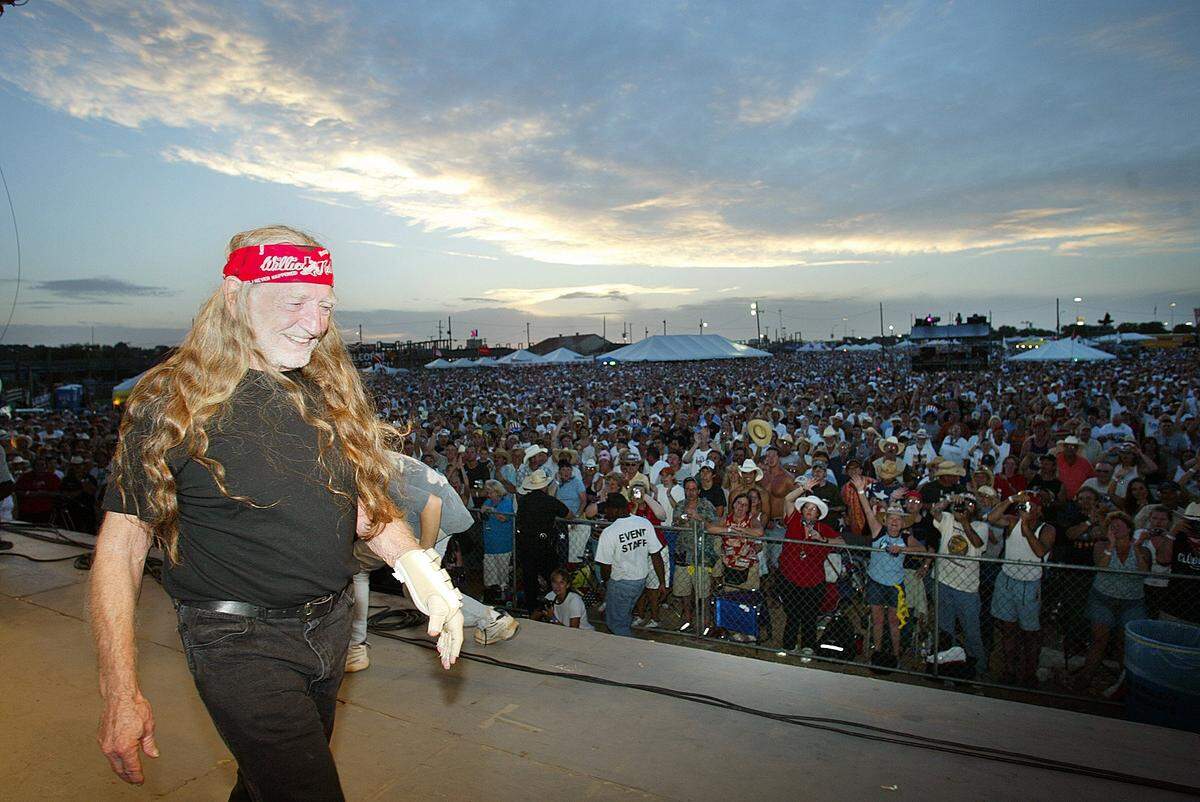 July 4, 2004: Wille Nelson exits the stage after being presented a city flag and proclamation by Fort Worth Councilman Jim Lane during the Willie Nelson’s Fourth of July Picnic at Billy Bob’s Texas.