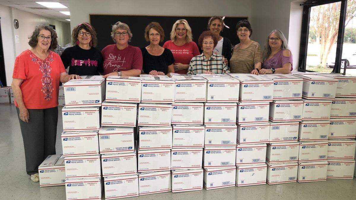 Blessing Box volunteers help women with breast cancer find hope and inspiration. Pictured are, from left, Jackie Dewveall, Karen Peyton, Dawn Compton (founder), Cheryl Townsend, Elizabeth Etter, Eileen DeVault, Karen Carpenter, Pam Scott and Debra Wooley.