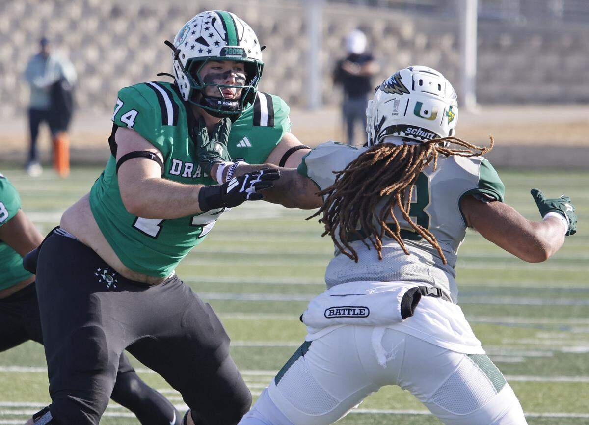 Southlake Carroll offensive lineman Luke Wilson (74) works against DeSoto defensive lineman Ja'den Randle (33) during the first half of a UIL Class 6A Division II semifinal on Saturday Dec. 13, 2025 at Vernon Newsom Stadium in Mansfield, Texas.