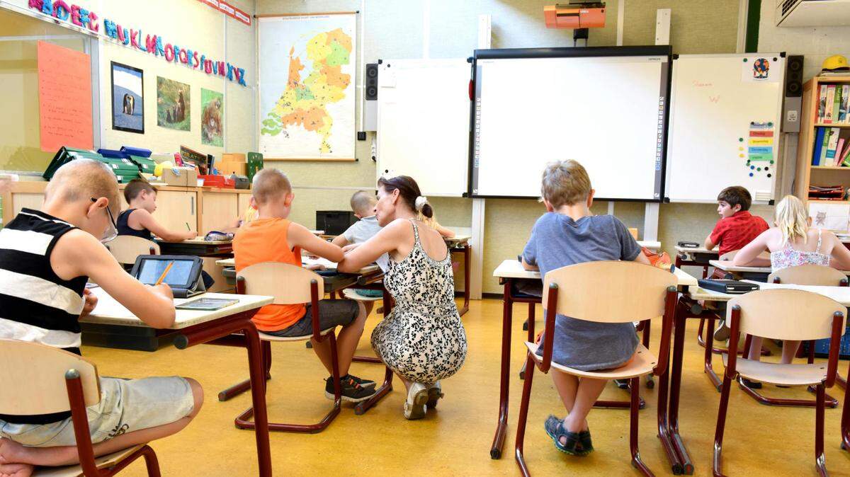 Children sitting in the classroom.