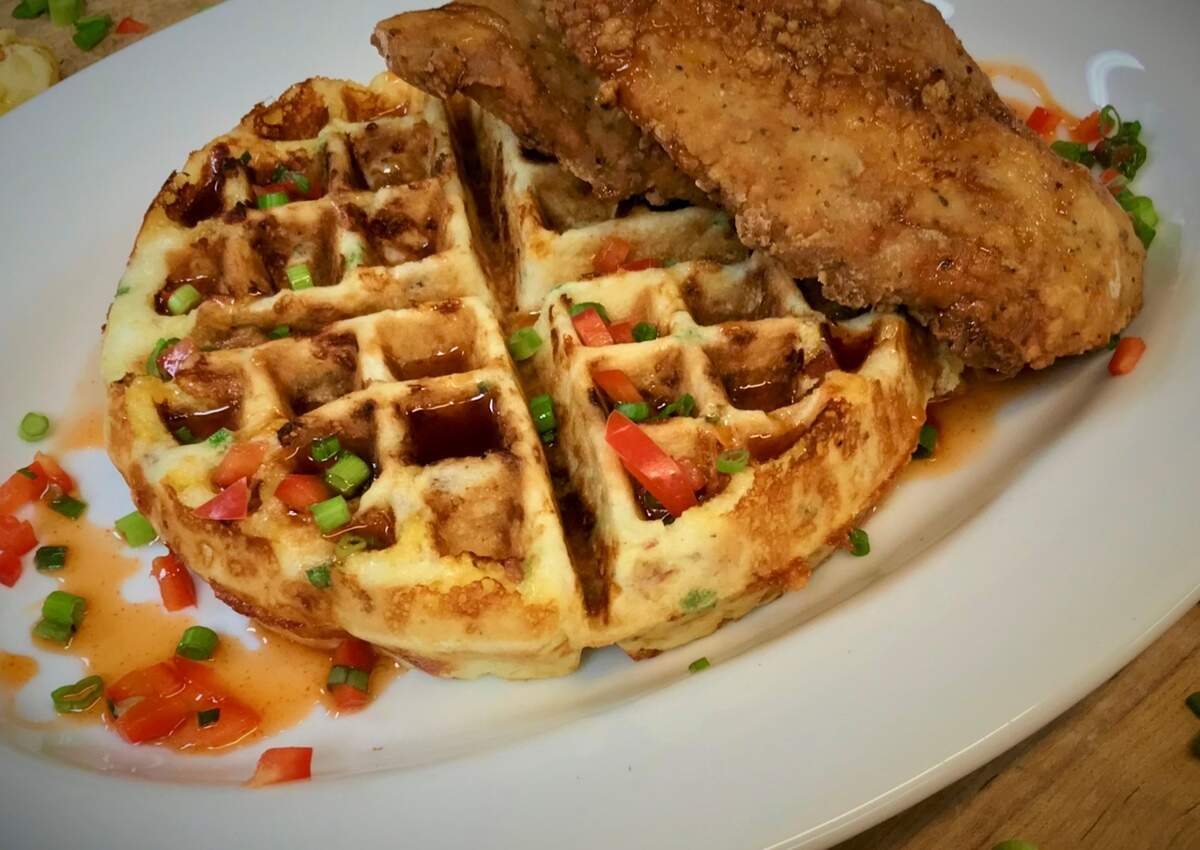 Chicken on a bacon-cheddar-onion wafflle at Reata.
