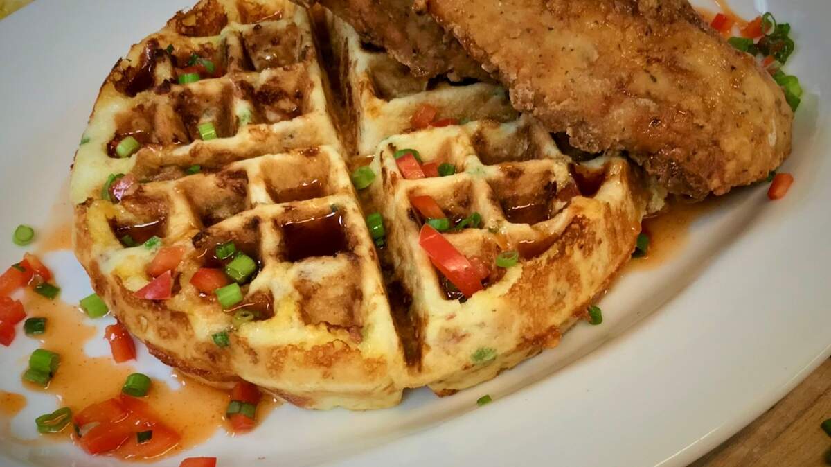 Chicken on a bacon-cheddar-onion wafflle at Reata.