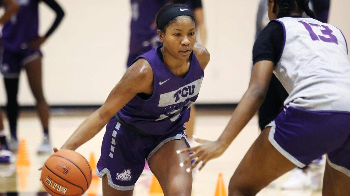 TCU’s Lauren Heard, left, drives the ball down the court during a practice drill on Monday, October 18, 2021, in Fort Worth.