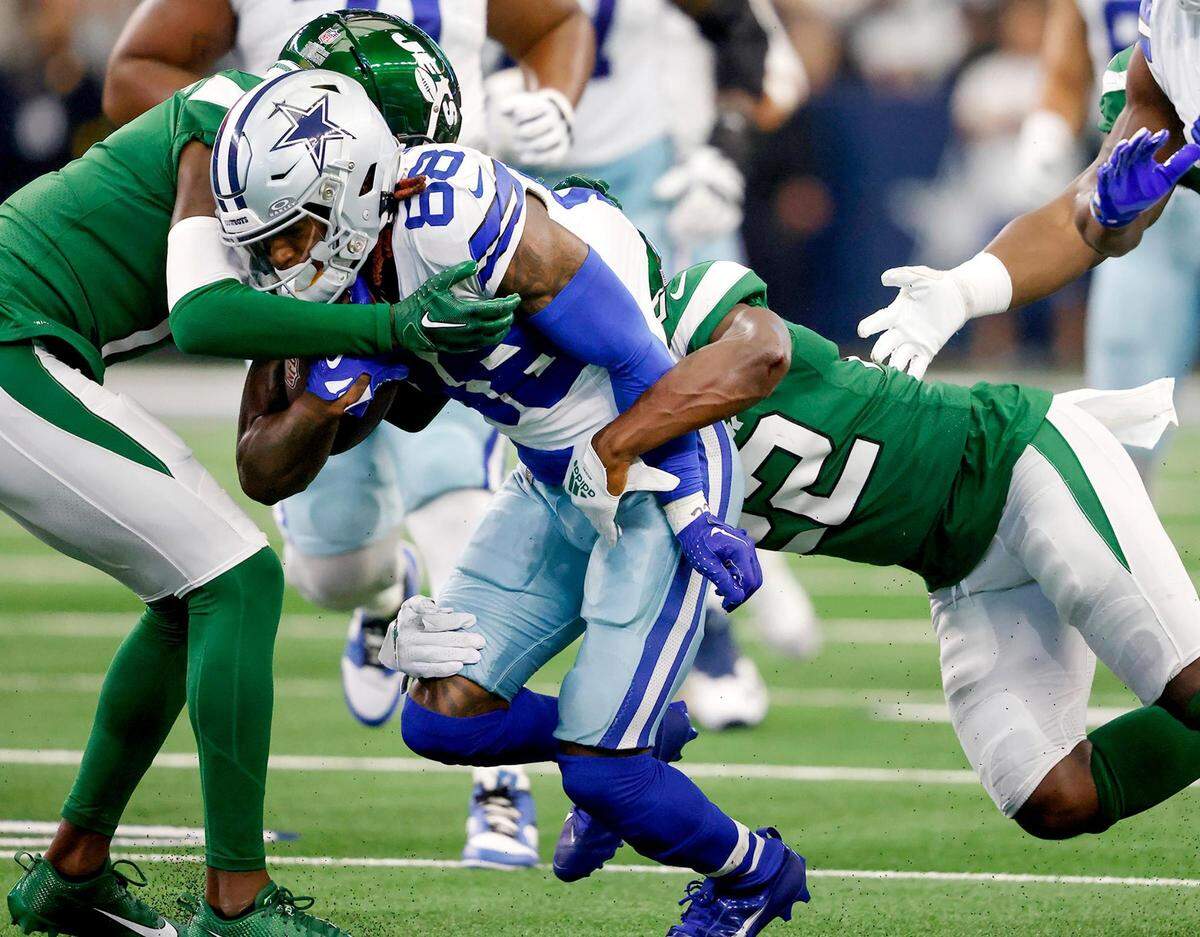 The New York Jets defense attempts to stop Dallas Cowboys wide receiver CeeDee Lamb on Sunday, September 17, 2023, at AT&T Stadium in Arlington.