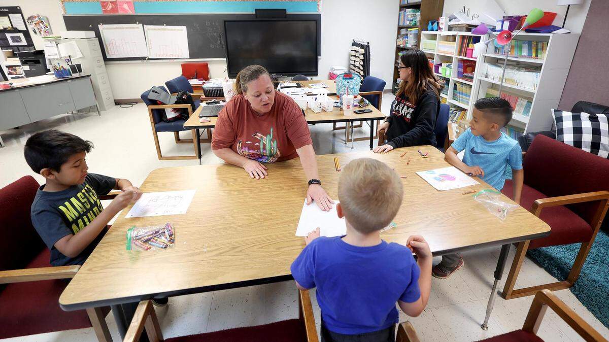 Teacher Melissa Lockhart, center, and paraprofessional Amber Spratlin, right, lead students Hayden Bolanos, Whitten Doyle and Diego Nava in instruction during a catch-up program in April at Houston Elementary in Mineral Wells.